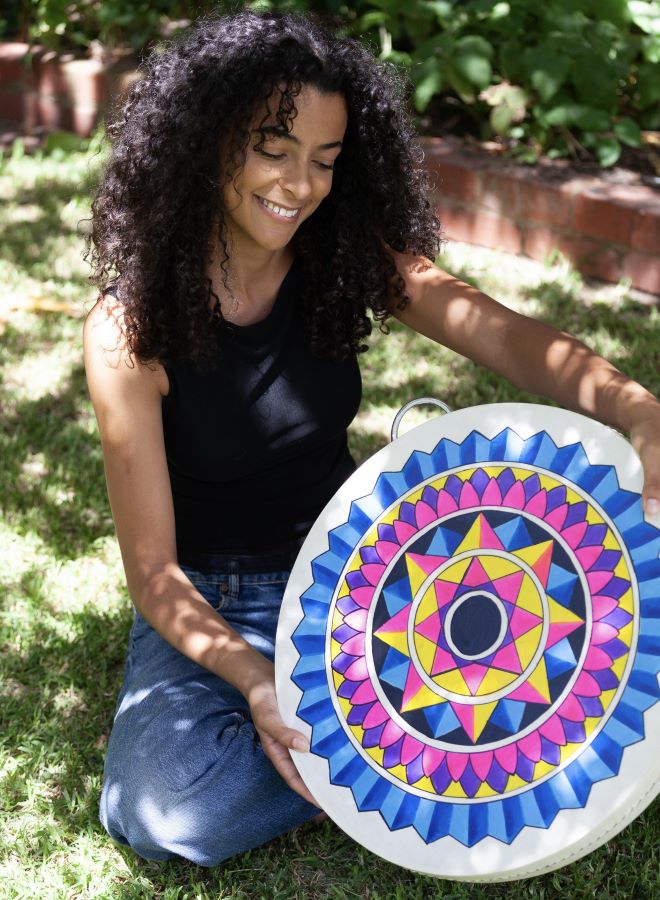 Woman playing Ocean Drum