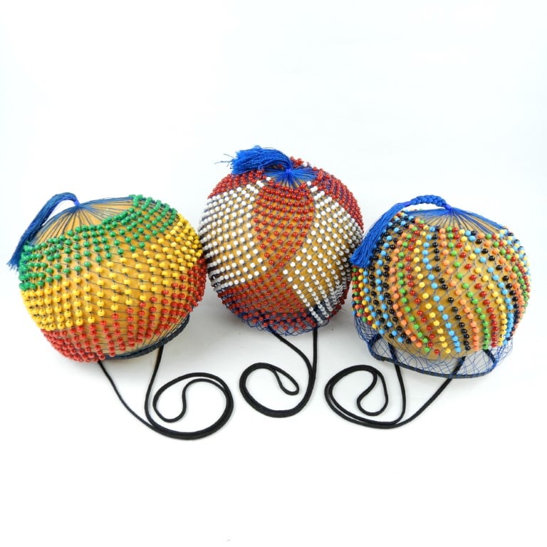 The shekere is an ancient traditional percussion instrument of West Africa. They are a central feature of traditional Ewe music.