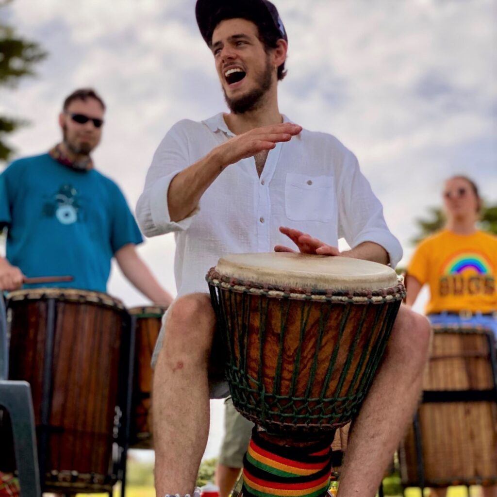 drummers playing djembe and dunun in the park