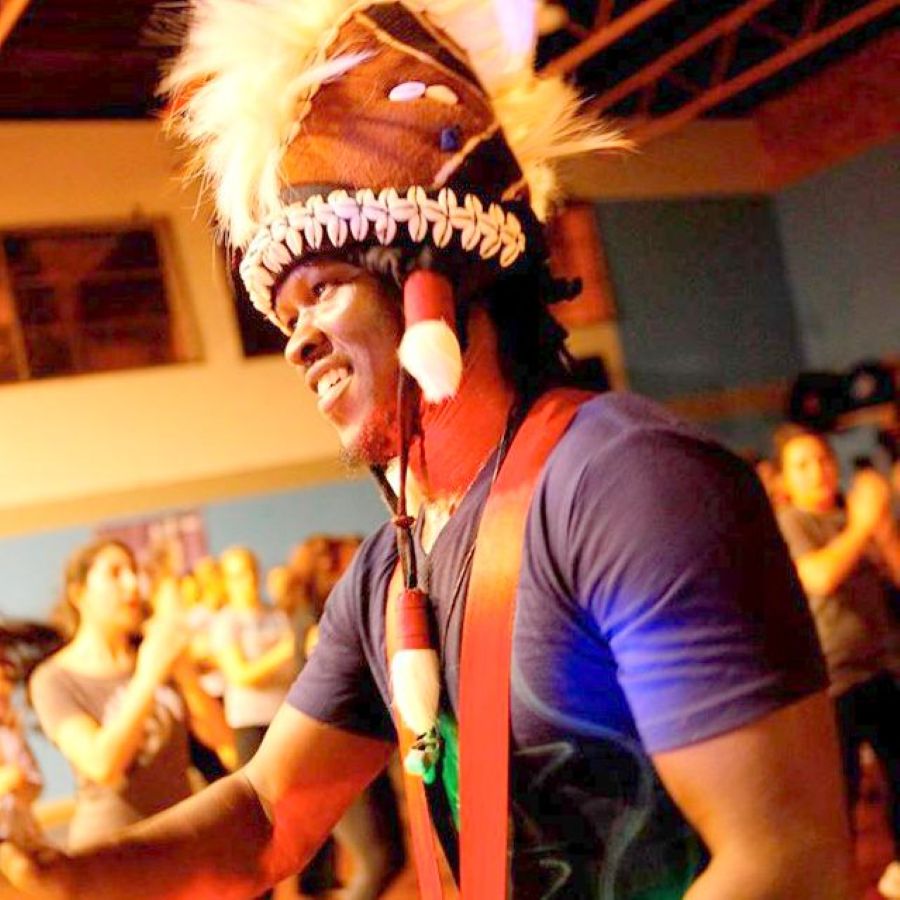 Boubacar Gaye leading a dance session at the Bali Drum Camp, wearing a traditional headdress