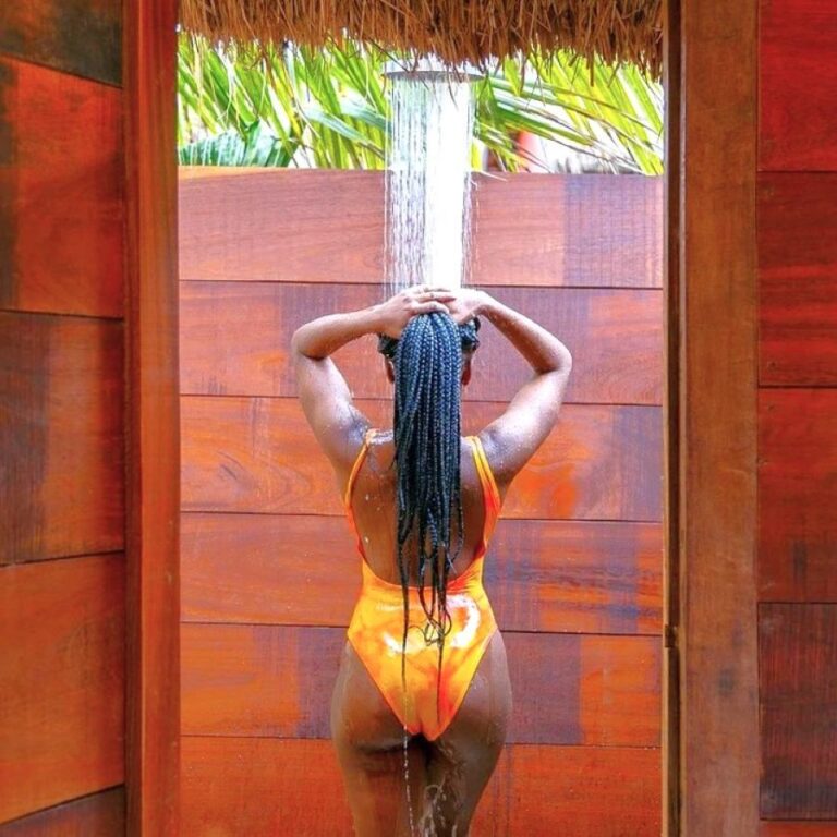 Relaxing outdoor shower at the Ghana retreat, with beautiful wooden walls and a serene atmosphere for a rejuvenating experience.