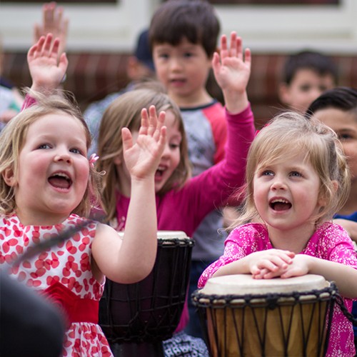 kids singing and playing djembe drums at a birthday party
