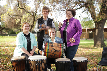 teachers standing with drums outdoors at the facilitator trainnig sessions