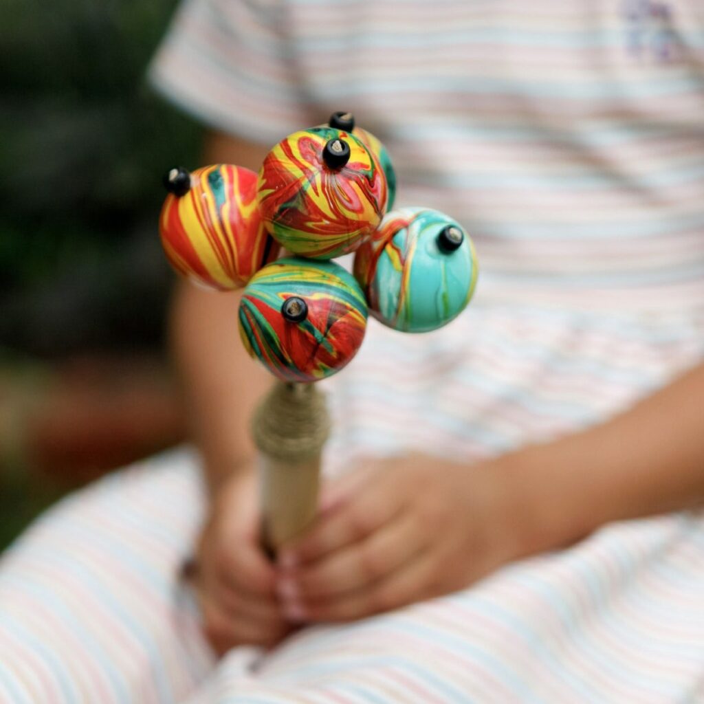 a colourful ping pong shaker