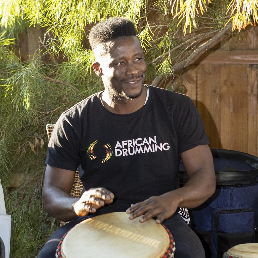 Mohamed Camara, African drumming teacher, playing djembe during a workshop