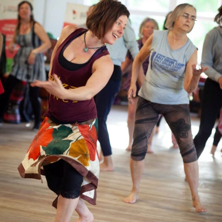 Group of women dancing together at the NZ Drum & Dance Camp.