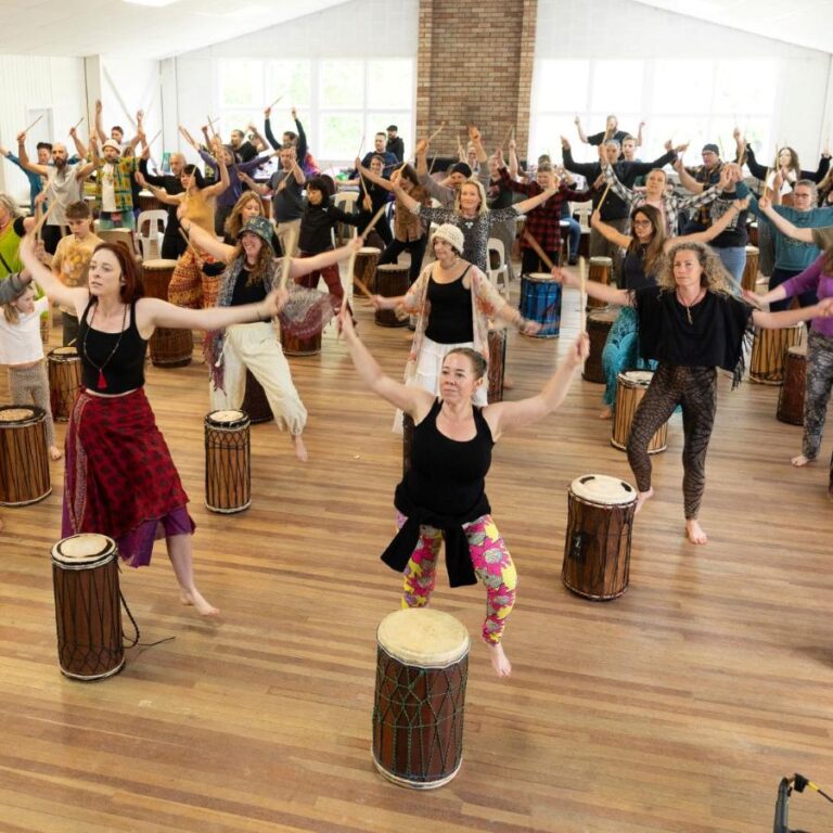Group of dancers performing together at the NZ Drum & Dance Camp.