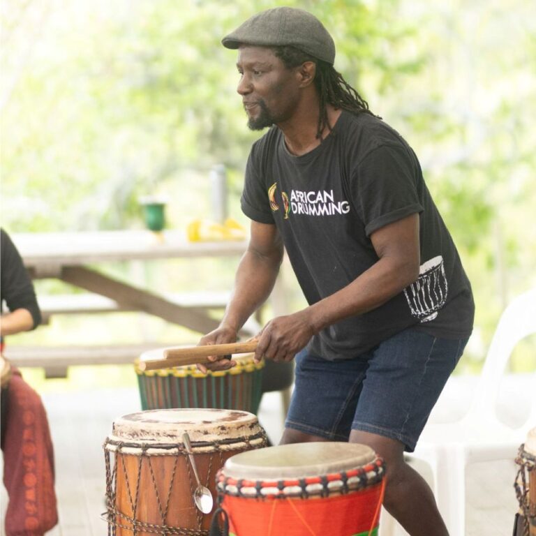 African Drumming facilitator leading a drum session at the NZ Drum & Dance Camp