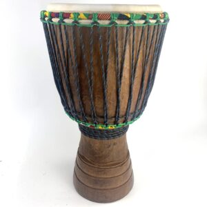 Front view of an Ivory Coast djembe showcasing its hand-carved wooden shell, natural goat skin head, and traditional rope tuning system.