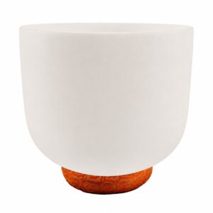 White frosted crystal singing bowl resting on a meditation cushion.