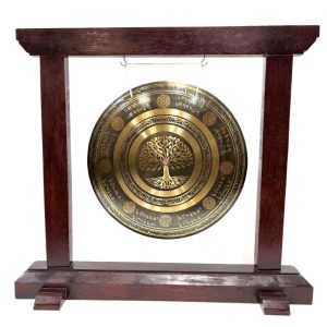 Wooden gong stand in Albizia timber holding a decorative brass gong