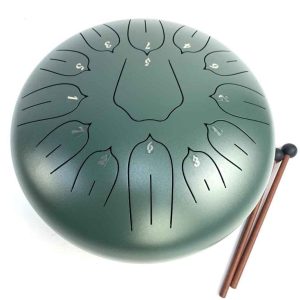 Green steel tongue drum with wooden mallets on white background.