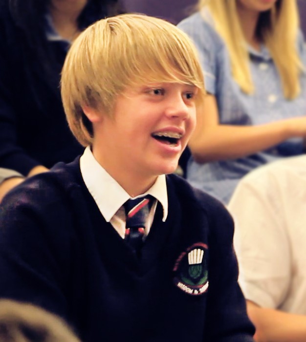 Secondary school student engaged and singing during a West African singing workshop