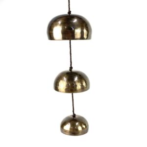 Three suspended Himalayan singing bowls with hand-knotted hanging cord and graduated bowl sizes